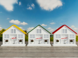 Three small white houses for sale, rent.