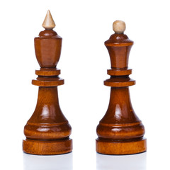 Wooden chessmen isolated on a white background. King and queen