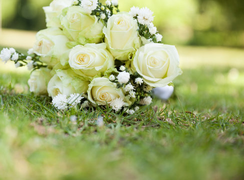 Bridal bouquet on grass at the park