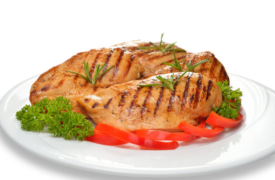 Grilled Chicken Breast With Vegetables On White Plate.