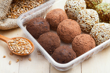 balls from ground wheat sprouts with sesame, pumpkin seeds and