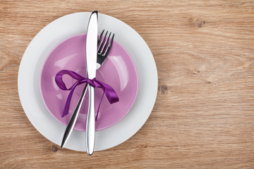 Fork with knife over plates