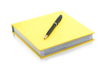 notebook with pen on a white background 