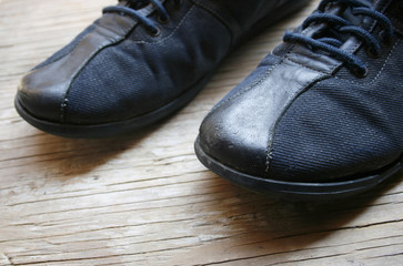 Old shoes on wooden floor