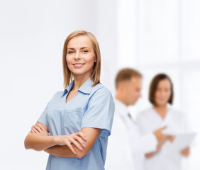 smiling female doctor or nurse