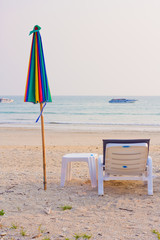 clear blue sky with beach umbrella