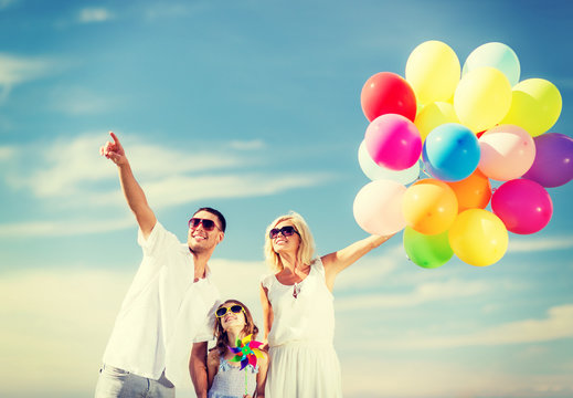 family with colorful balloons