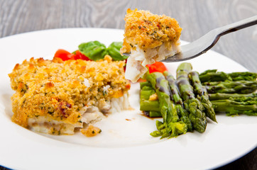 cod fish with crispy breadcrumbs and asparagus