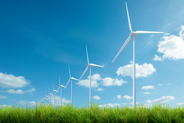 wind turbine with grass and blue sky