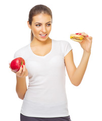 Young girl with apple and hamburger