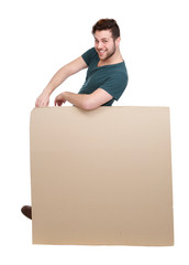Man leaning on blank poster board