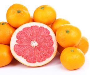 Ripe sweet tangerines and grapefruit, isolated on white