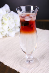 Glass of cocktail on table close-up