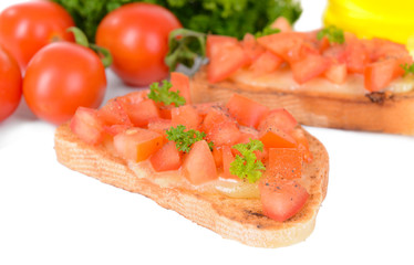 Delicious bruschetta with tomatoes on table close-up
