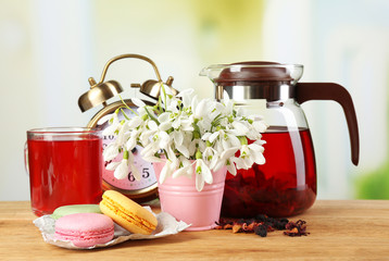 Tasty herbal tea and cookies on wooden table