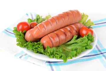Grilled sausage on plate on table close-up