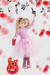 Girl with guitar on music notes background