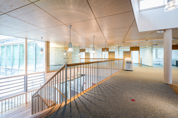 bright wooden lobby hall of modern office building