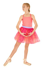 cute young girl ballerina posing wearing a pink tutu