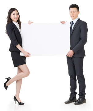 Business man and woman holding blank white board