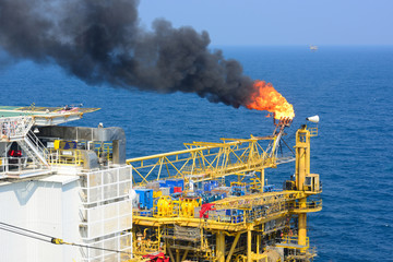 The gas flare is on the offshore oil rig