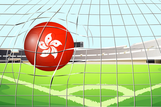 A soccer ball at the field with the flag of Hongkong