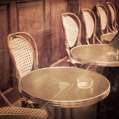 old-fashioned coffee terrace with tables and chairs,paris France