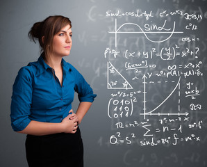 Beautiful school girl thinking about complex mathematical signs