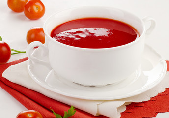 Tomato soup in a white bowl