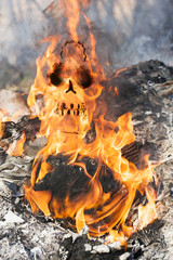 Human skull in fire flames