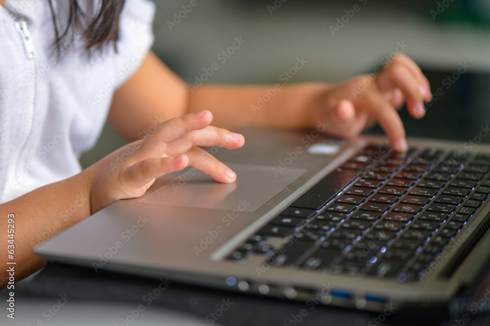 Wall mural little hand and keyboard notebook