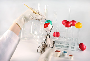 Happy Easter science people! Scientist painting Easter eggs.