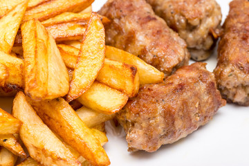 Traditional Romanian Dinner With Mici And French Fries