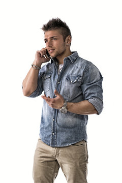 Handsome Upset Young Man Talking On Cell Phone (mobile)