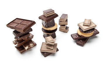 Stack of chocolate pieces on a white background