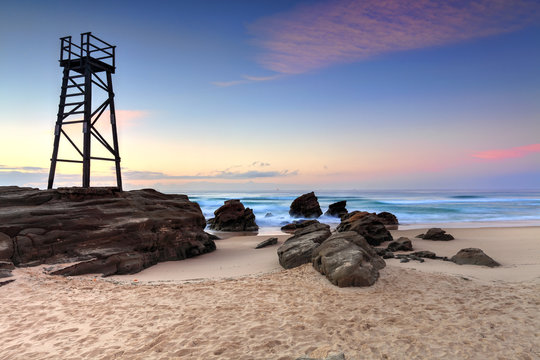 Shark Watch Tower and jagged rocks  Australia