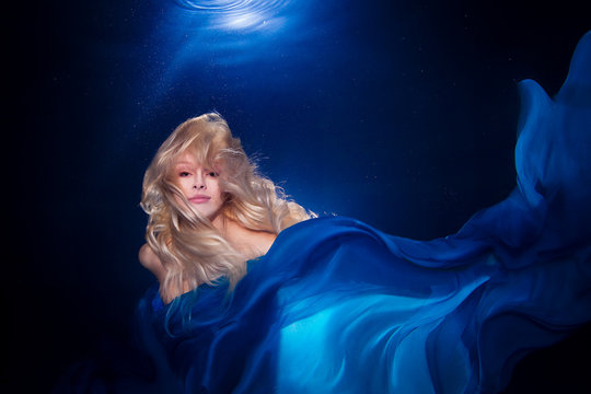 underwater photo pretty young girl  with blond long hair wearing