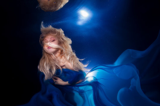 underwater photo pretty young girl  with blond long hair wearing