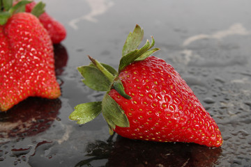 Close-up of a strawberry on black background