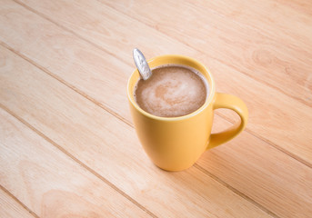 Coffee cup on wooden table