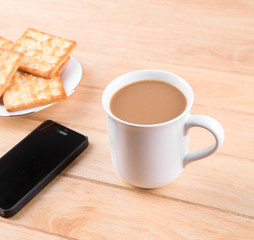 Coffee cup with the bread and put on the table.