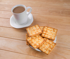 Coffee cup on the table with bread sticks.
