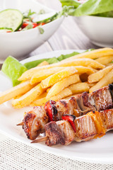 Grilled shashlik with chips