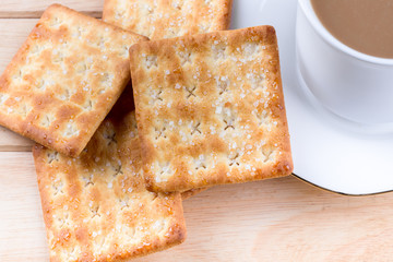 Coffee cup on the table with bread sticks.