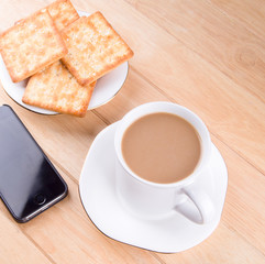 Coffee cup with the bread and put on the table.