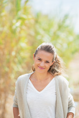 Portrait of happy young woman outdoors