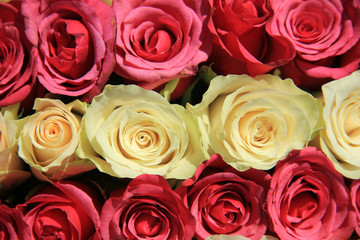 Pink roses in different shades in wedding arrangement