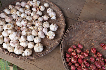 thai garlic and thai onion on wooden table