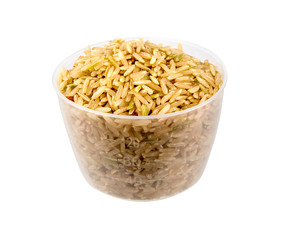 Brown rice in a cup isolated on white