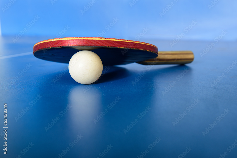 Wall mural pin pong ball with red paddle on blue board